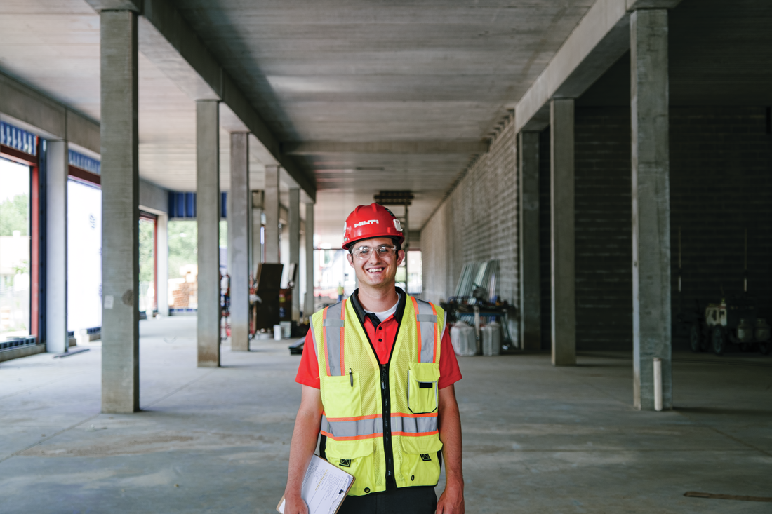 Account manager smiling on construction site