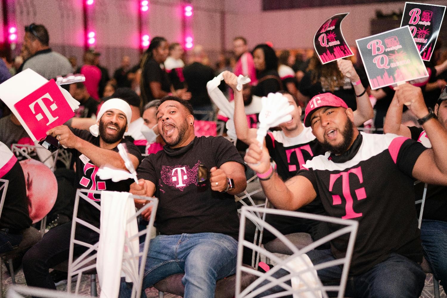 Team Magenta shows up and shows out with customary swag to greet visiting senior leaders at a New York Town Hall.
