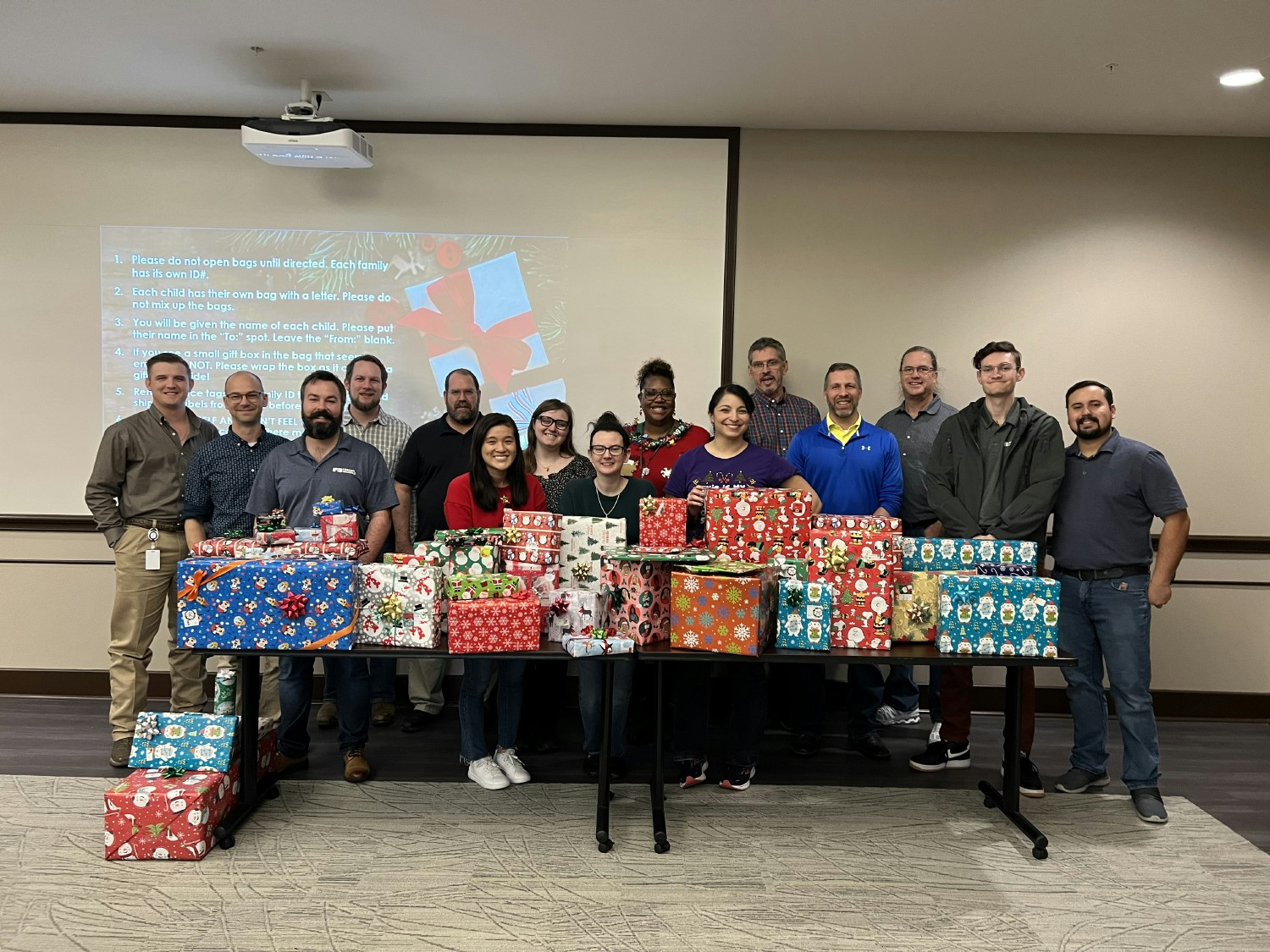 Fort Worth employees give back to the community by wrapping and distributing holiday gifts for 132 children and adults