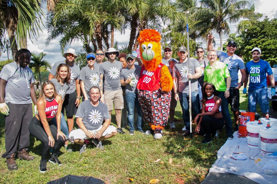 Ultimate Software and Miami HEAT employees take a rest from Rebuilding Together on Veteran's Day.