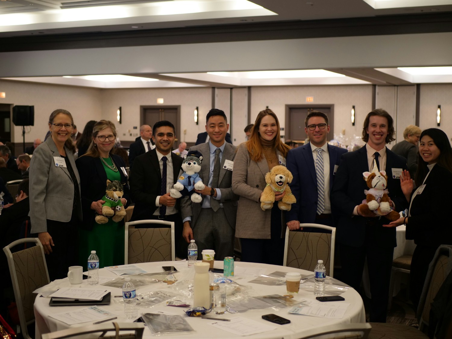 Group of IPMers posing with their stuff animals they built for a charity event.