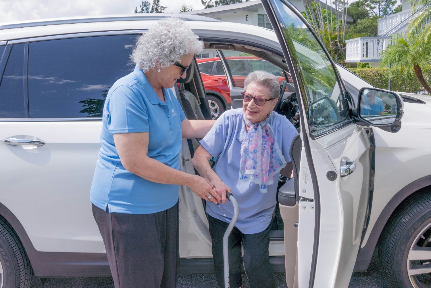 Care manager assisting Holocaust Survivor with transportation to a physician's office. 