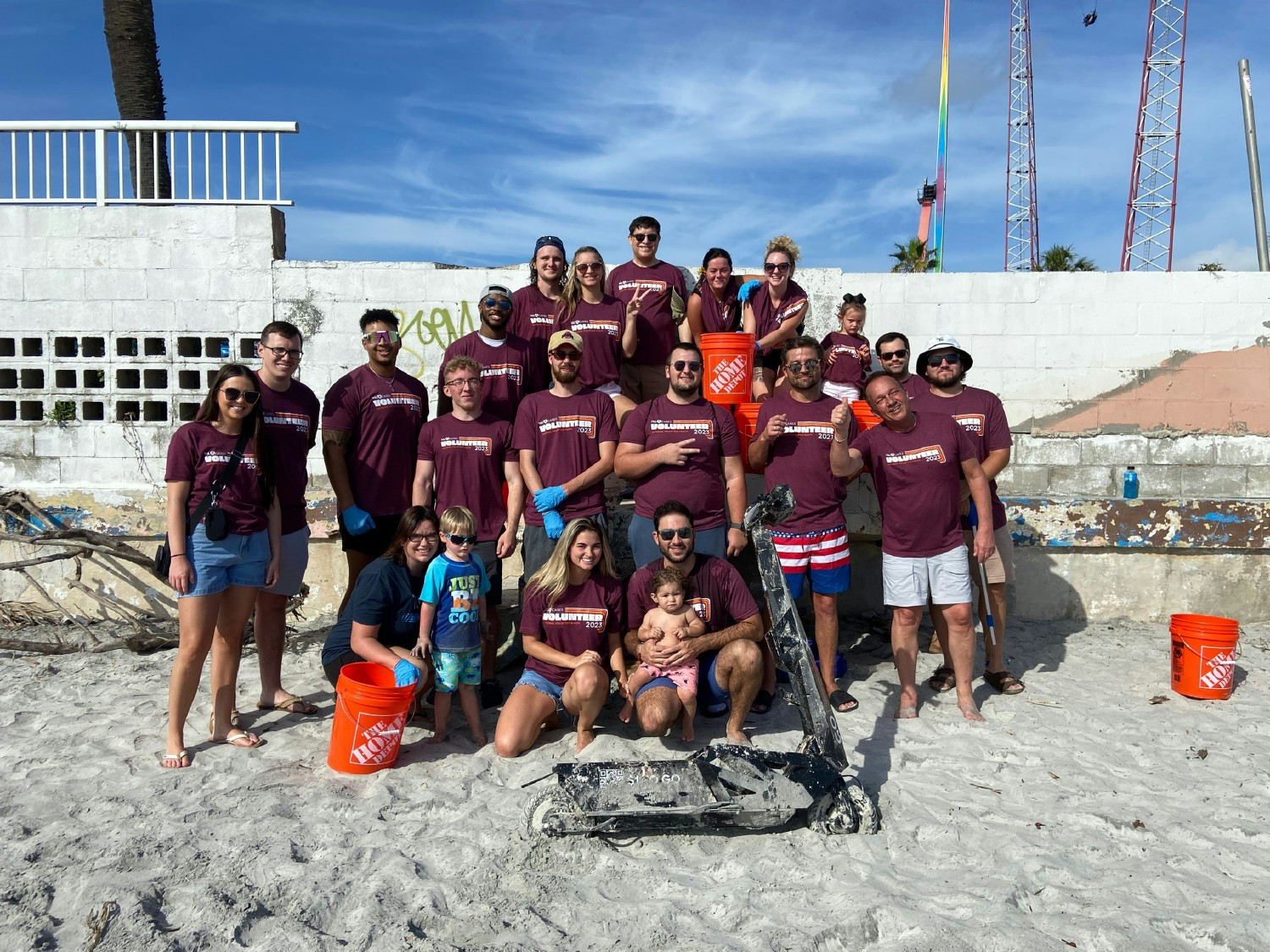 TQL Employees cleaning up a local beach at a team volunteer outing.