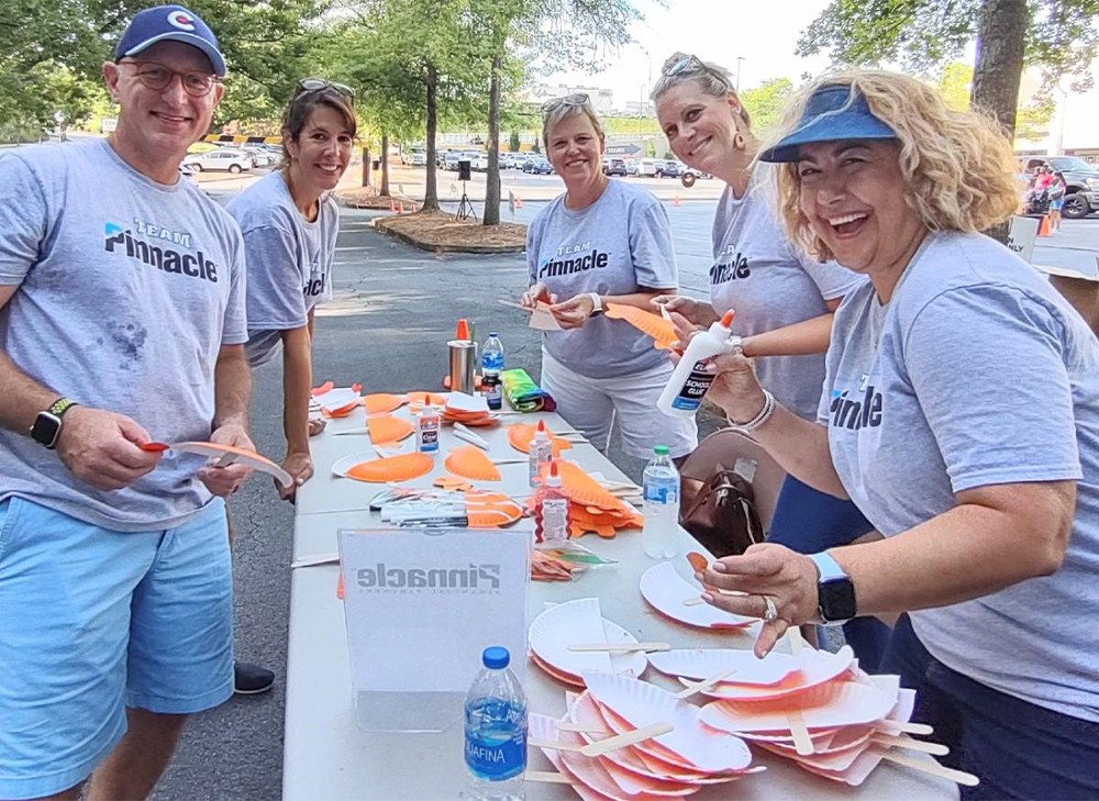 Pinnacle associates create stronger bonds with one another and with their communities by volunteering in group projects.
