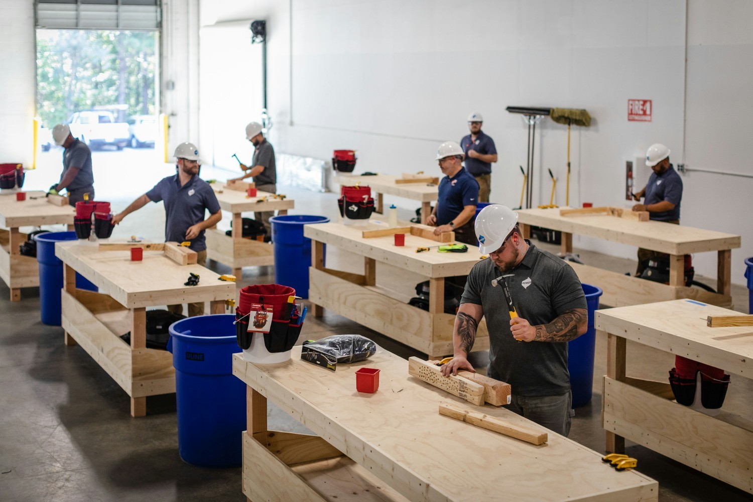 Employees learn fundamental construction and installation skills in Power’s Dan Price Craftsmanship Academy. 