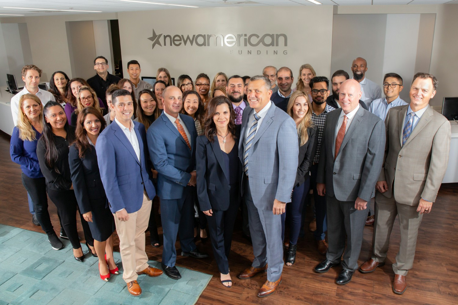 New American Funding employees with CEO, Rick Arvielo and President, Patty Arvielo