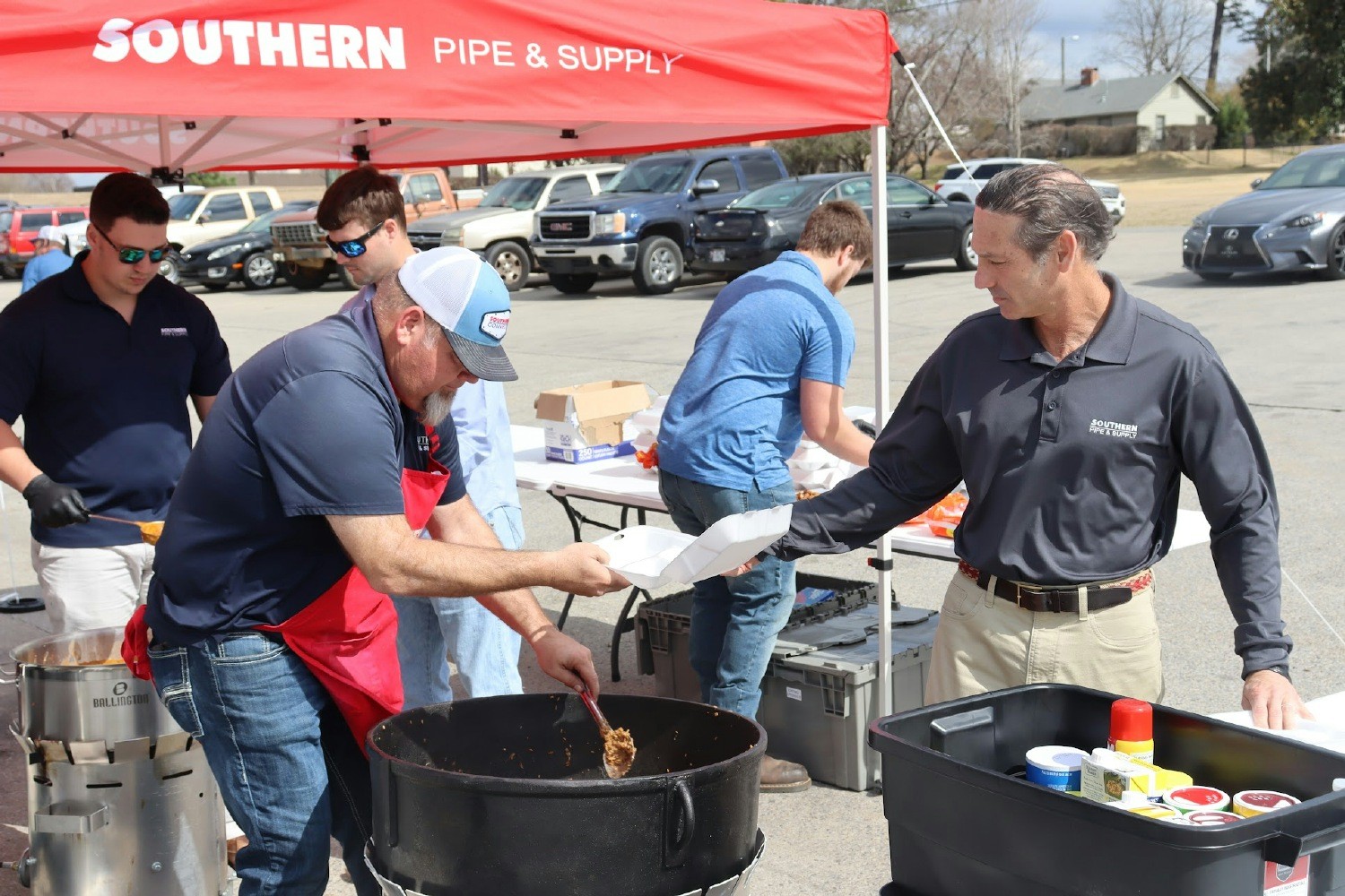 Jay Davidson (CEO) serving lunch at Distribution Center Cookout