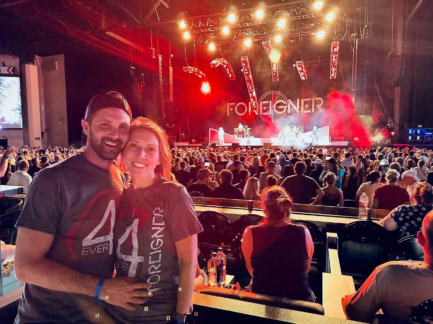 Employee and partner enjoying free tickets to a concert with CCU company seats.