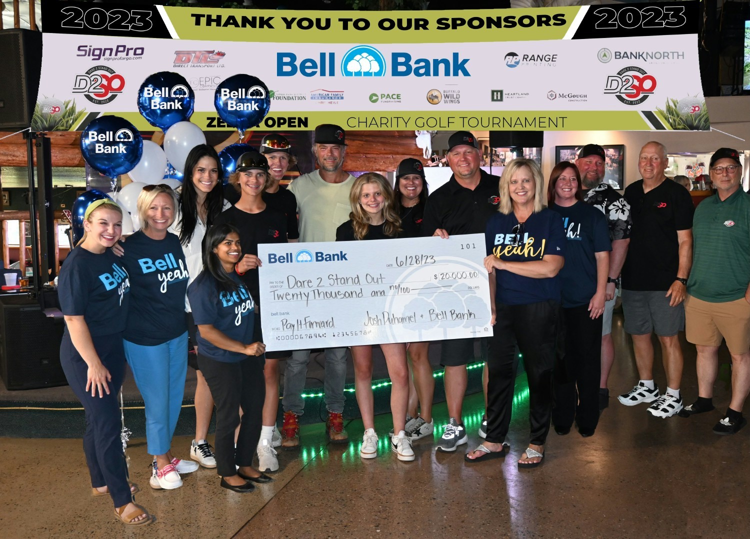 Emmy-winning actor, N.D. native and Bell Champion Josh Duhamel presents a Pay It Forward check to a local nonprofit. 