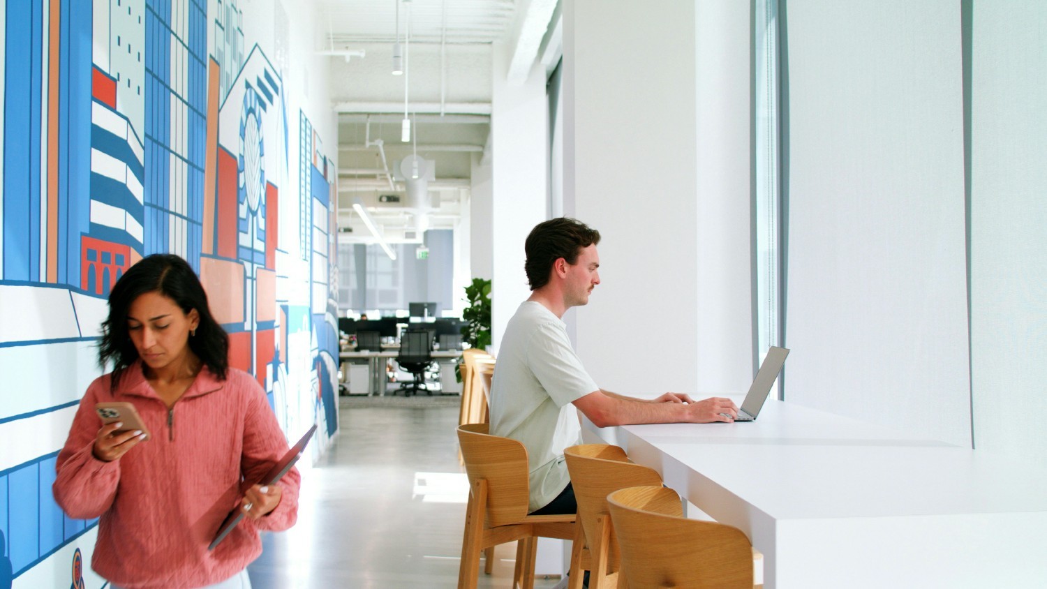 Asana employees working from the office