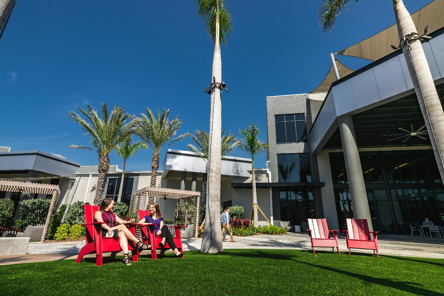 Power Design's 40-acre campus is connected through The Plaza, complete with plenty of outdoor seating and cabanas.