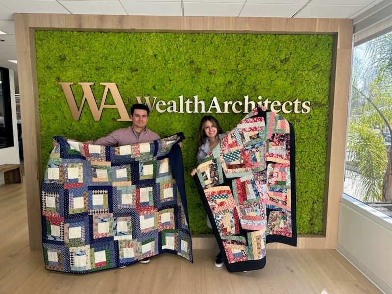 Team members gifted hand made quilts from client.