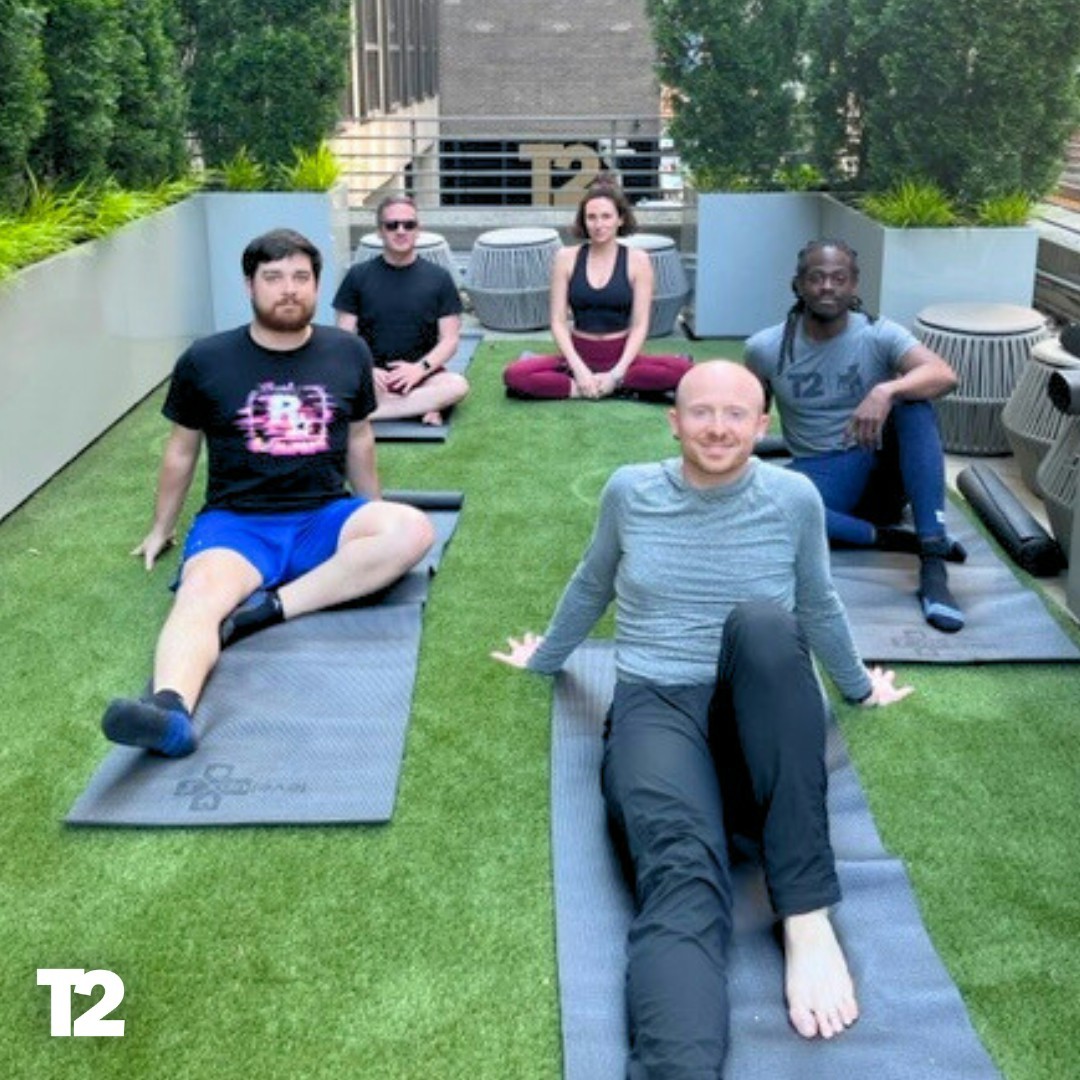 Our colleagues take a yoga break on the terrace at our headquarters in New York City.