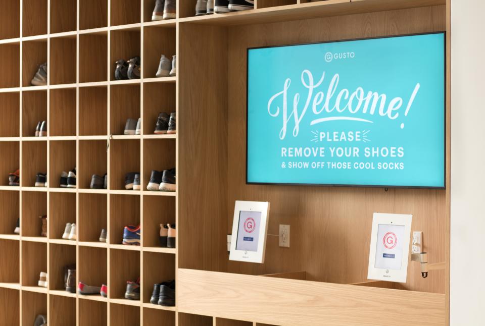 Gusto is a shoeless office owing to its roots as a startup founded in a Palo Alto, Calif., house. Employees, business partners and guests keep their shoes in walls of shoe-cubbies.