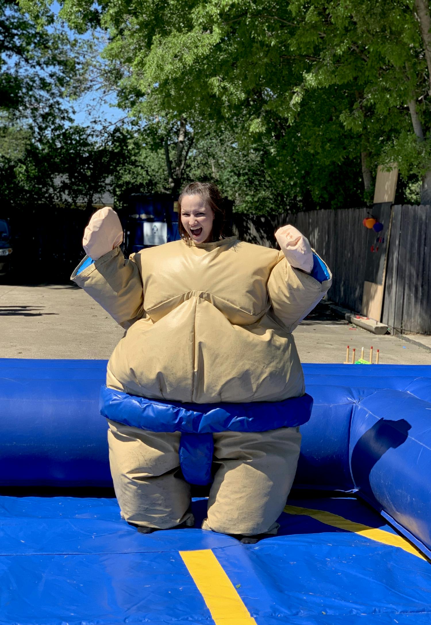 Our customer service manager is ready to take on her next Sumo opponent at the family carnival. 