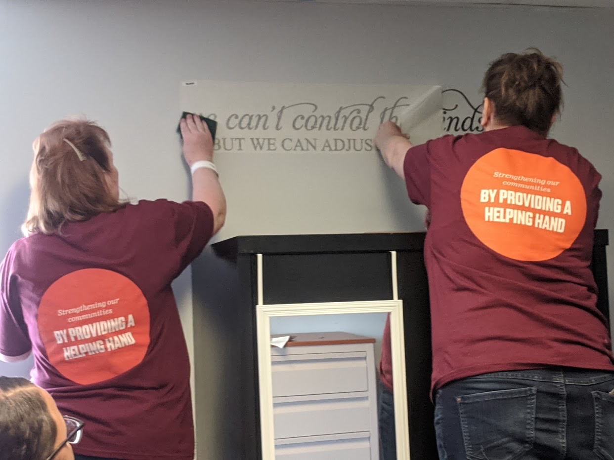 Affinity employees putting final additions on a project for a local non-profit organization
