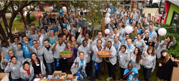Leumi employees pose after volunteering at the Jardin La Roca Garden community greenspace in Bronx, NY in 