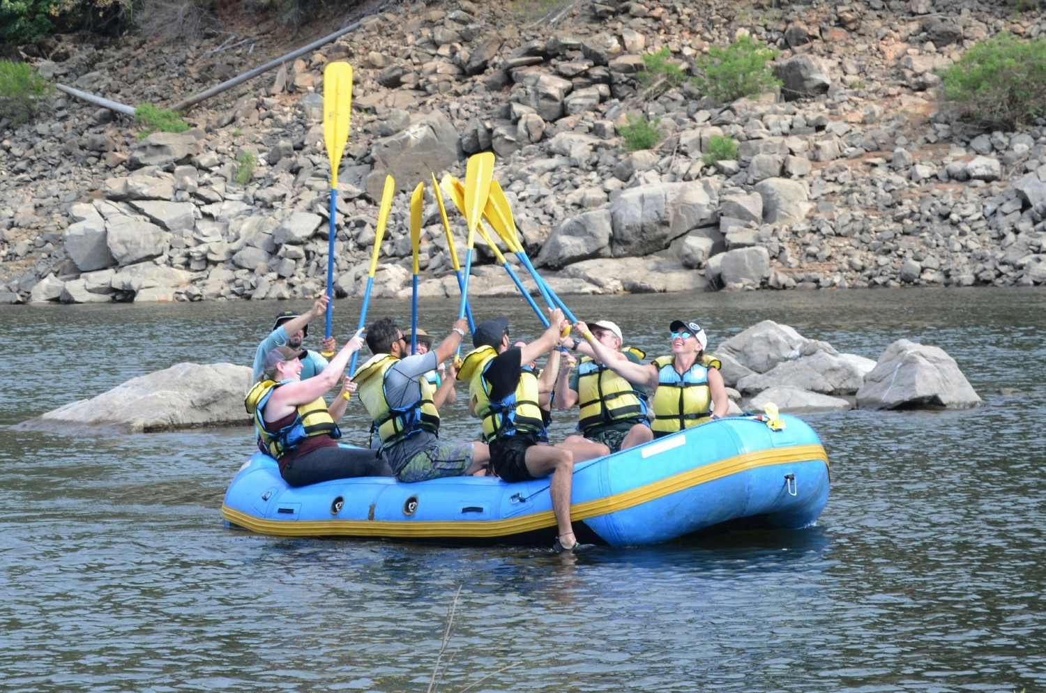 Raising our paddles to another fun group water rafting adventure.