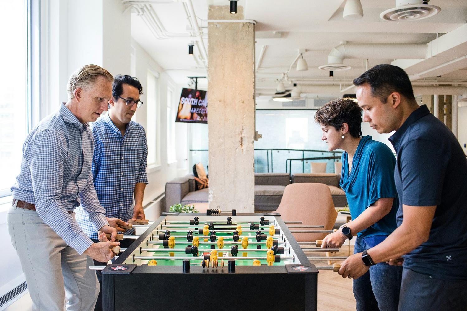 Playing fooseball with the CEO in the amenities lounge at OneSpan's headquarters in Chicago.
