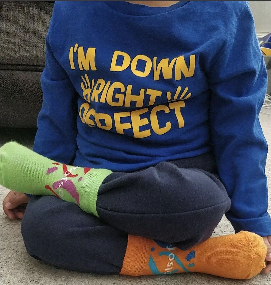 We have many employee resource groups under our Exabeam CommUNITY Council. This picture represents Down Syndrome Day. 