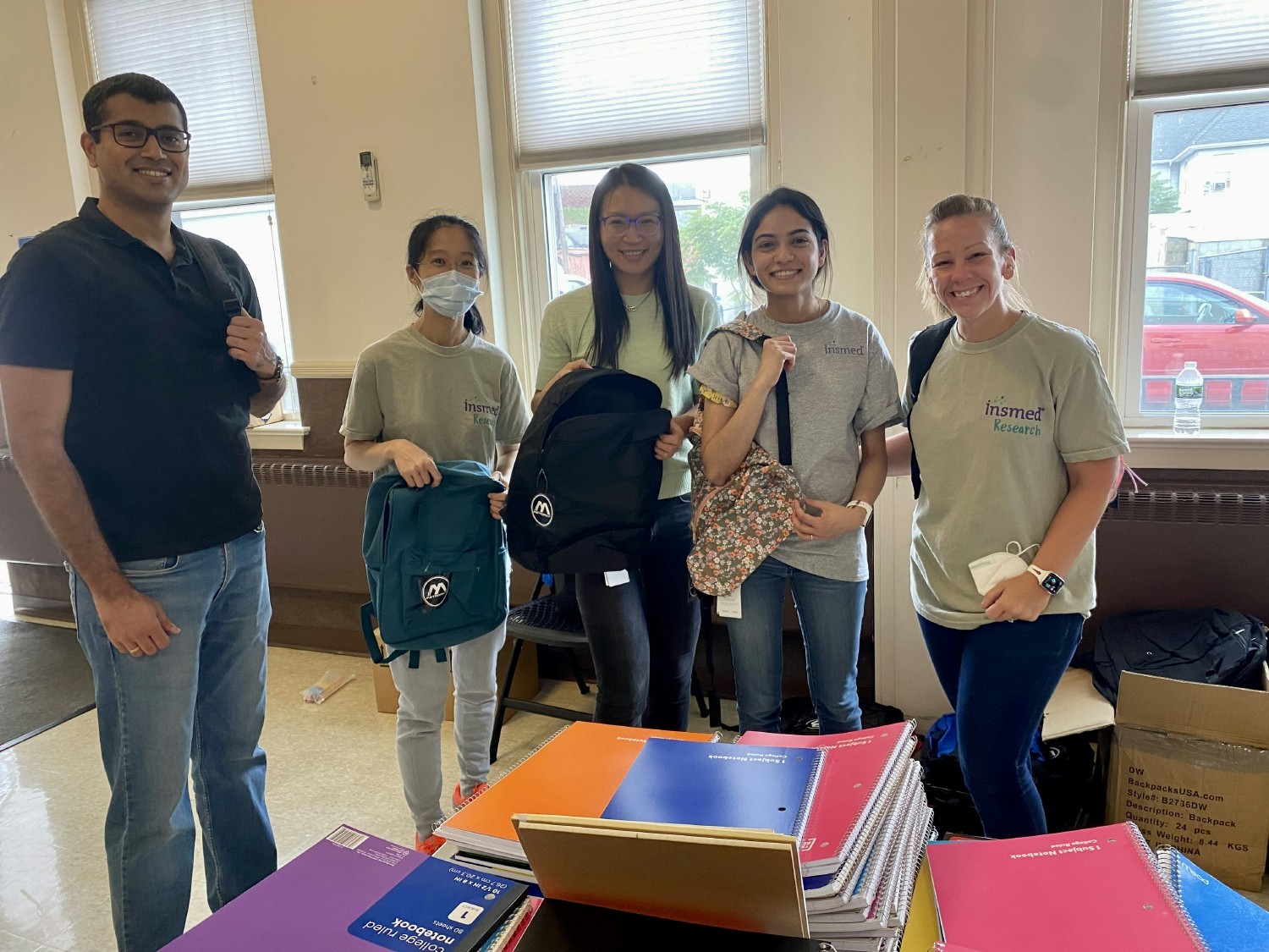 Insmed team members volunteering at a back-to-school supplies drive
