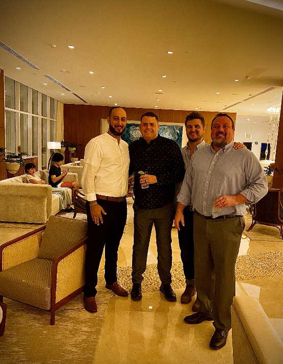 Mosa Emamjomeh, Jeff Fossett, Brad Baker, and Brian Trentham on a company trip to Cancun