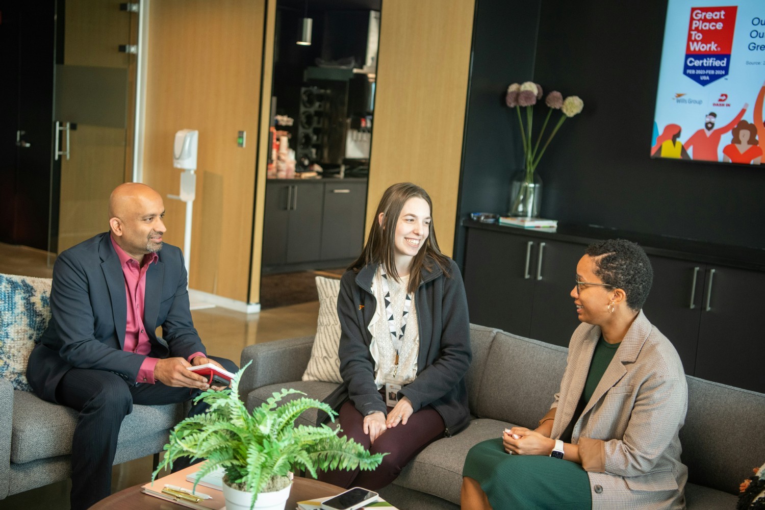 Diverse groups of employees discuss what it means to be a Great Place to Work. 
