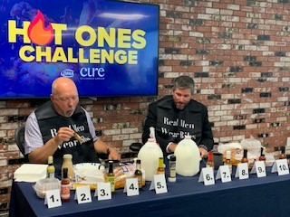 DMA put on a Hot Ones Challenge with brave employees to support CURE Childhood Cancer. 