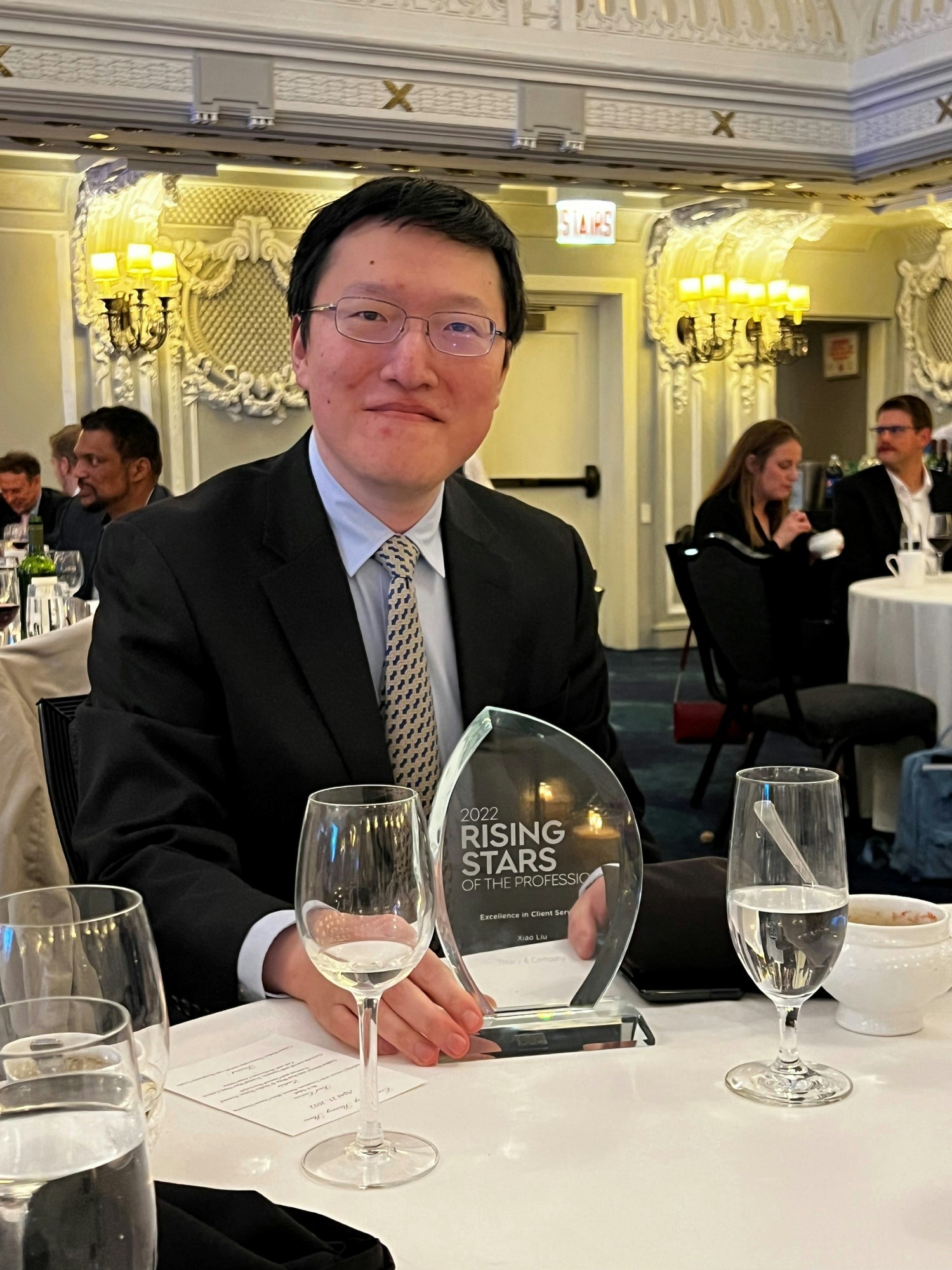 Xiao winning Consulting Magazine's Rising Star Award.