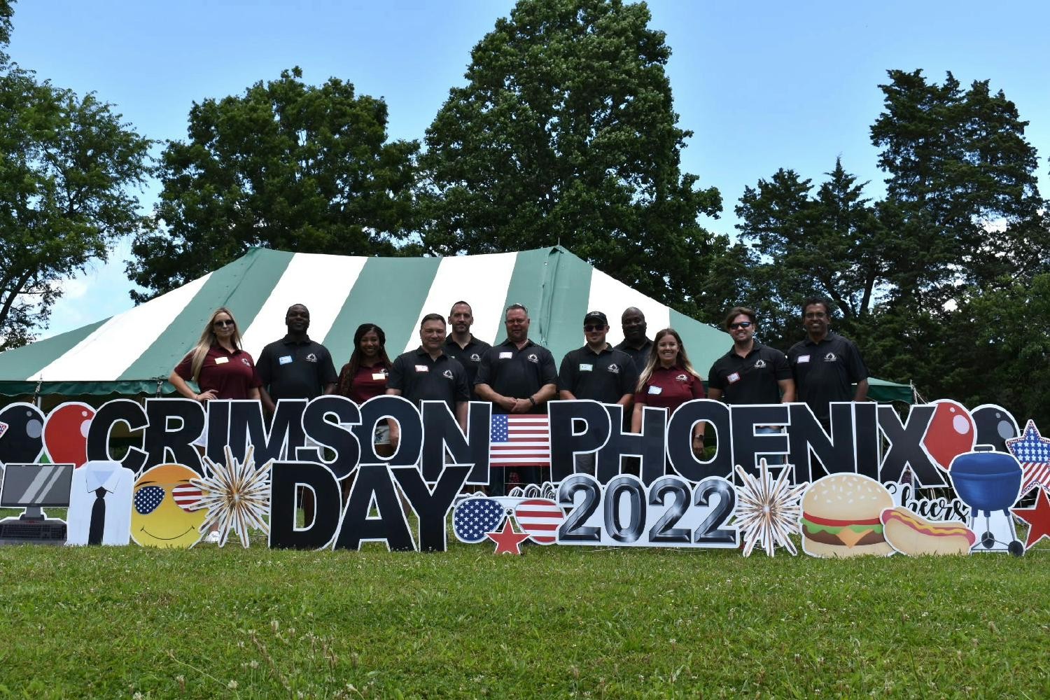 Crimson Phoenix Leadership at annual Crimson Phoenix  Day Picnic with CEO, Phil Hubbell in the middle. 