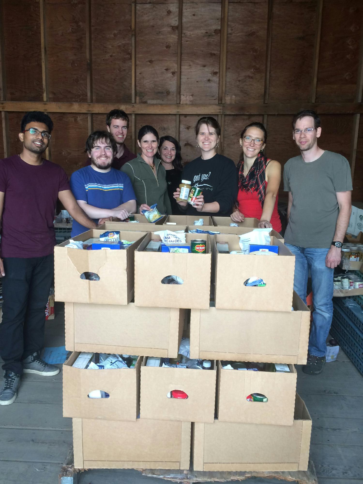 Seeq employees build boxes at the community food bank during an all-team meetup.
