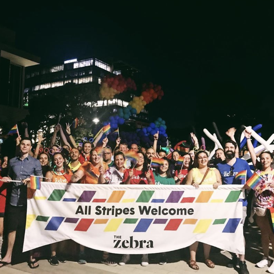 Employees of The Zebra marching in 2019 Austin Pride.