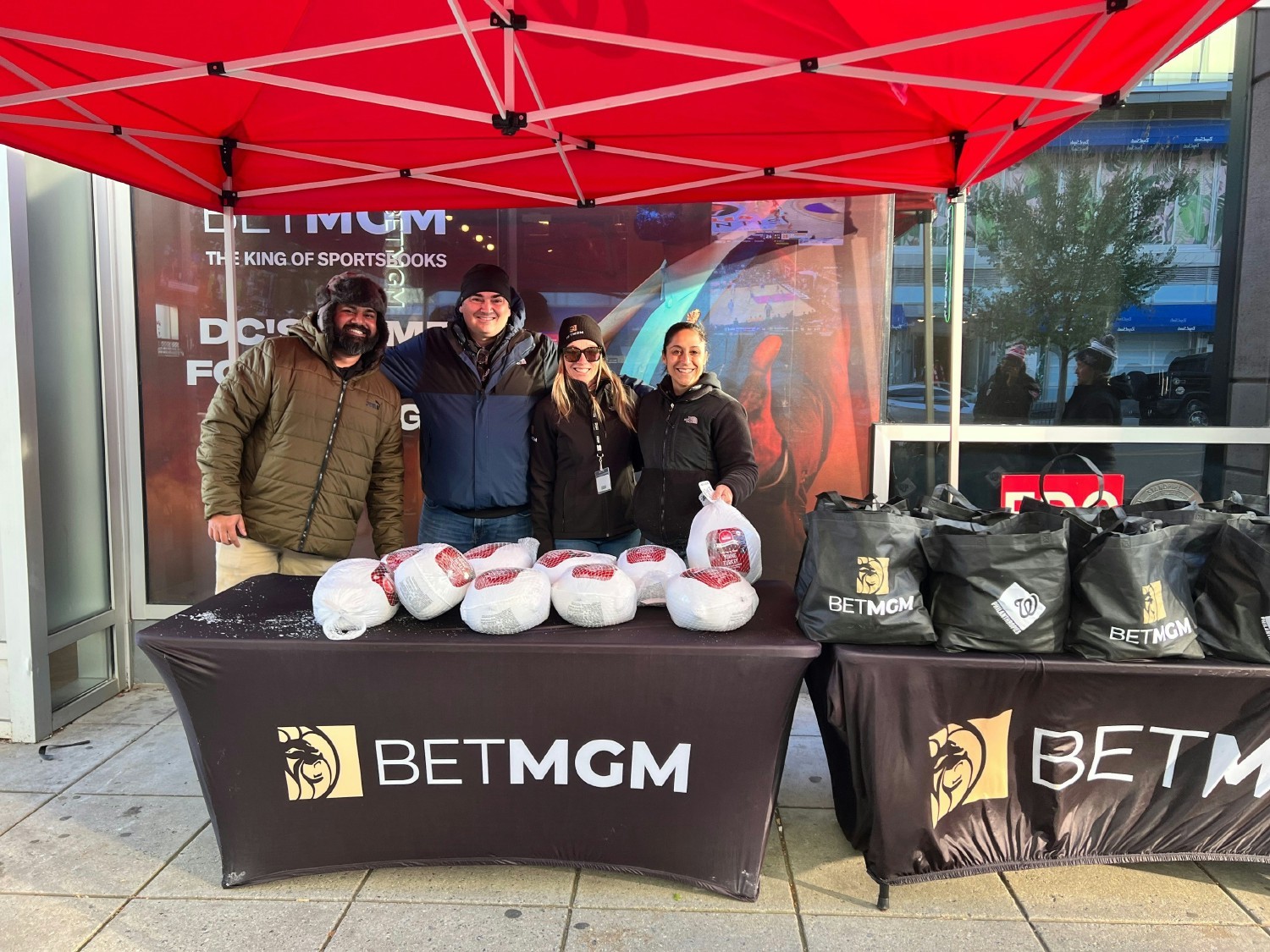 Employees in D.C. partner with the Washington Nationals for Turkeypalooza to distribute 800 turkeys to families in need.