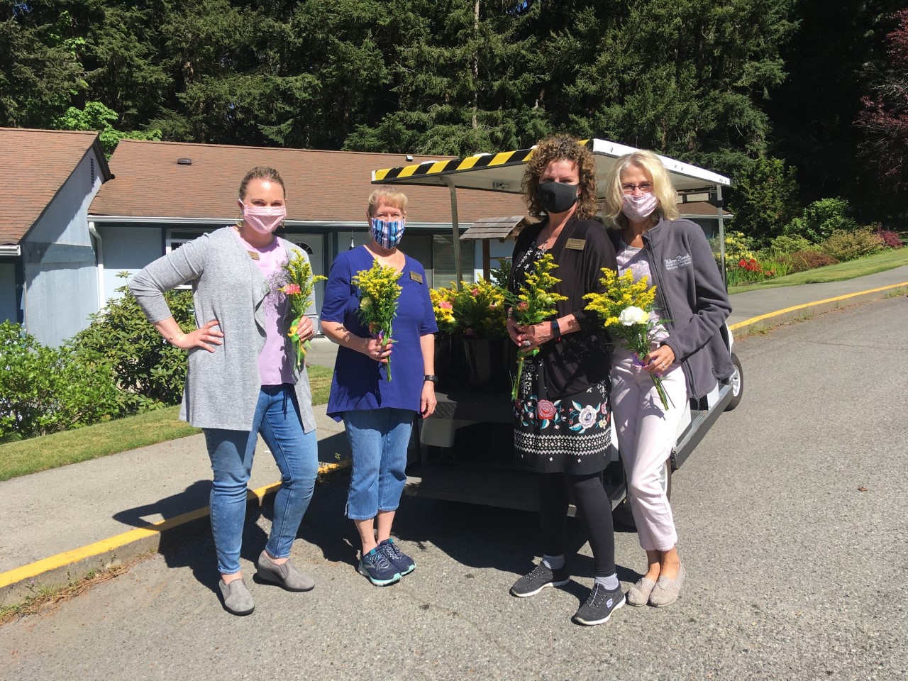 Staff delivering flowers to residents on Mother's day 2020