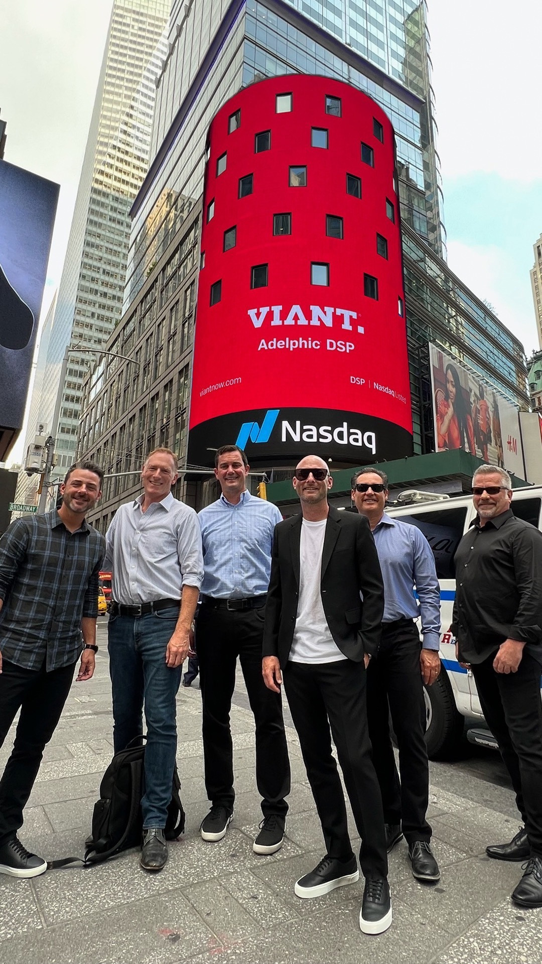 Members of our leadership team proudly stand in front of our Viant billboard on the NASDAQ tower in NYC.