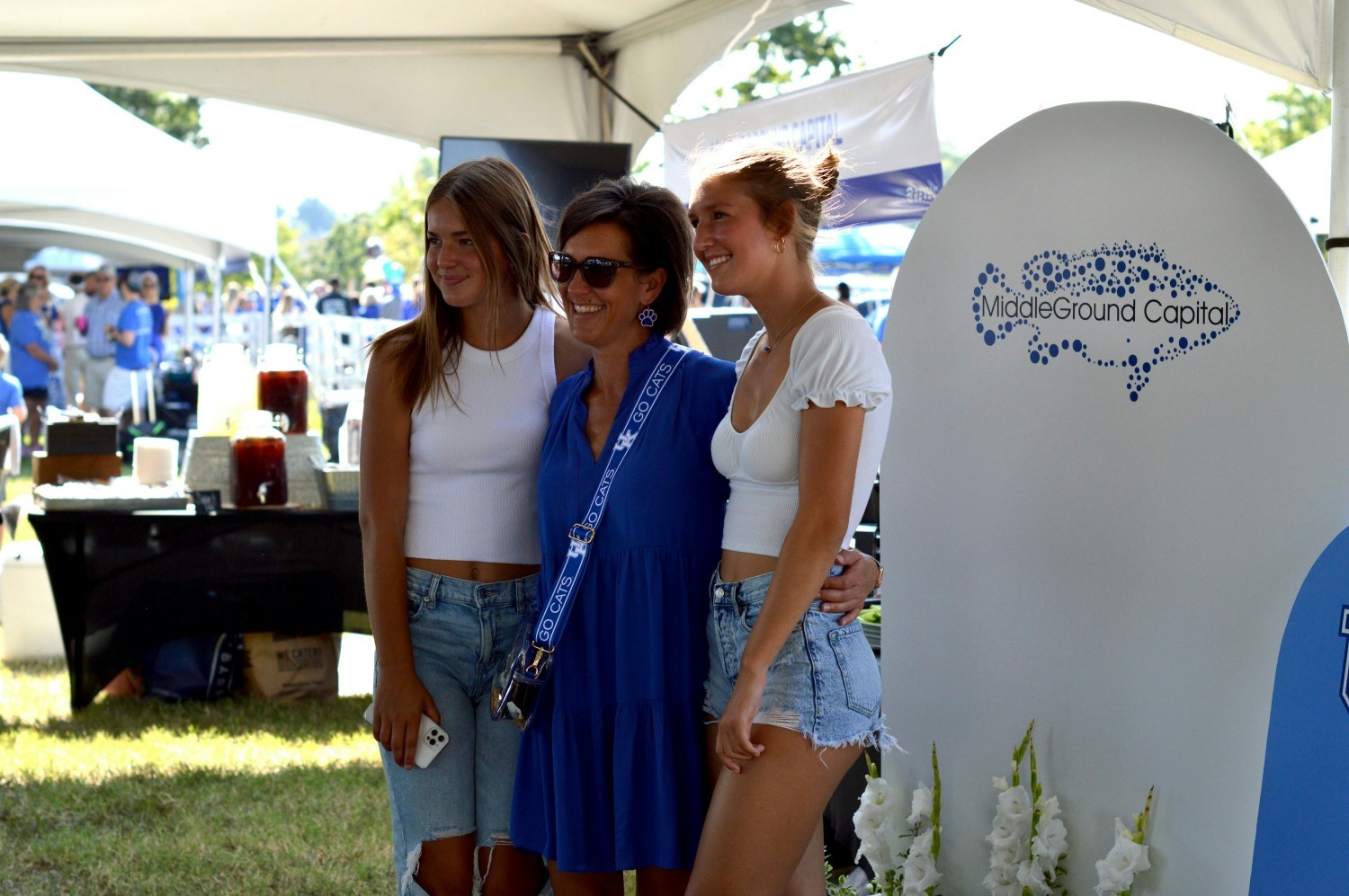 An employee attending the company tailgate at the University of Kentucky with her daughters.