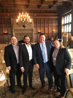 Our corporate leadership team spending time with one of our partners at an event in downtown Chicago.