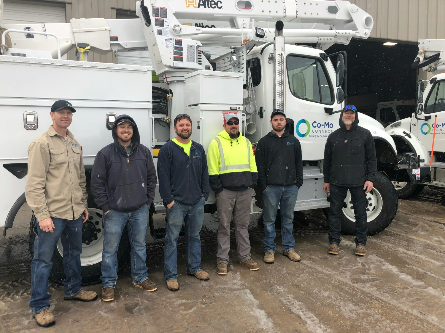 Co-Mo linemen pose for a photo before heading out to assist a neighboring cooperative following a severe weather event.