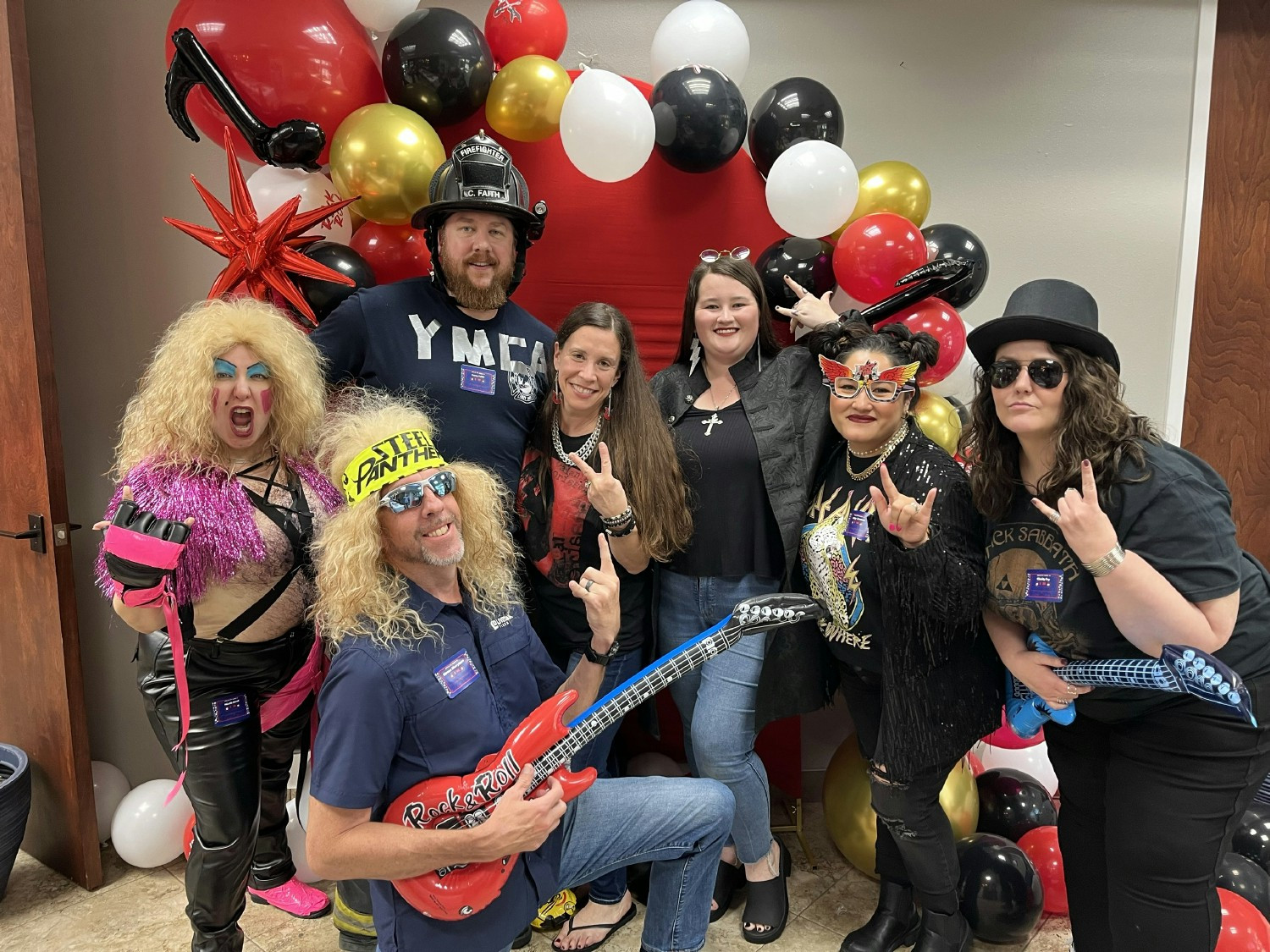 Employees dressed up for our rock-n-roll Town Hall.