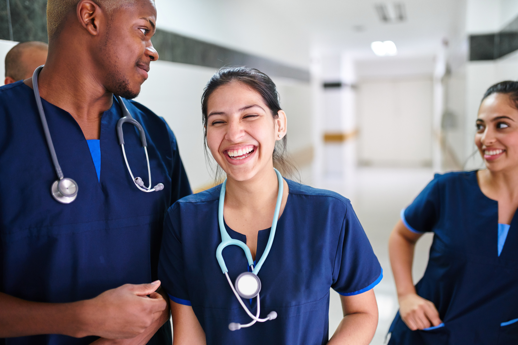  a group of three young medical professionals 