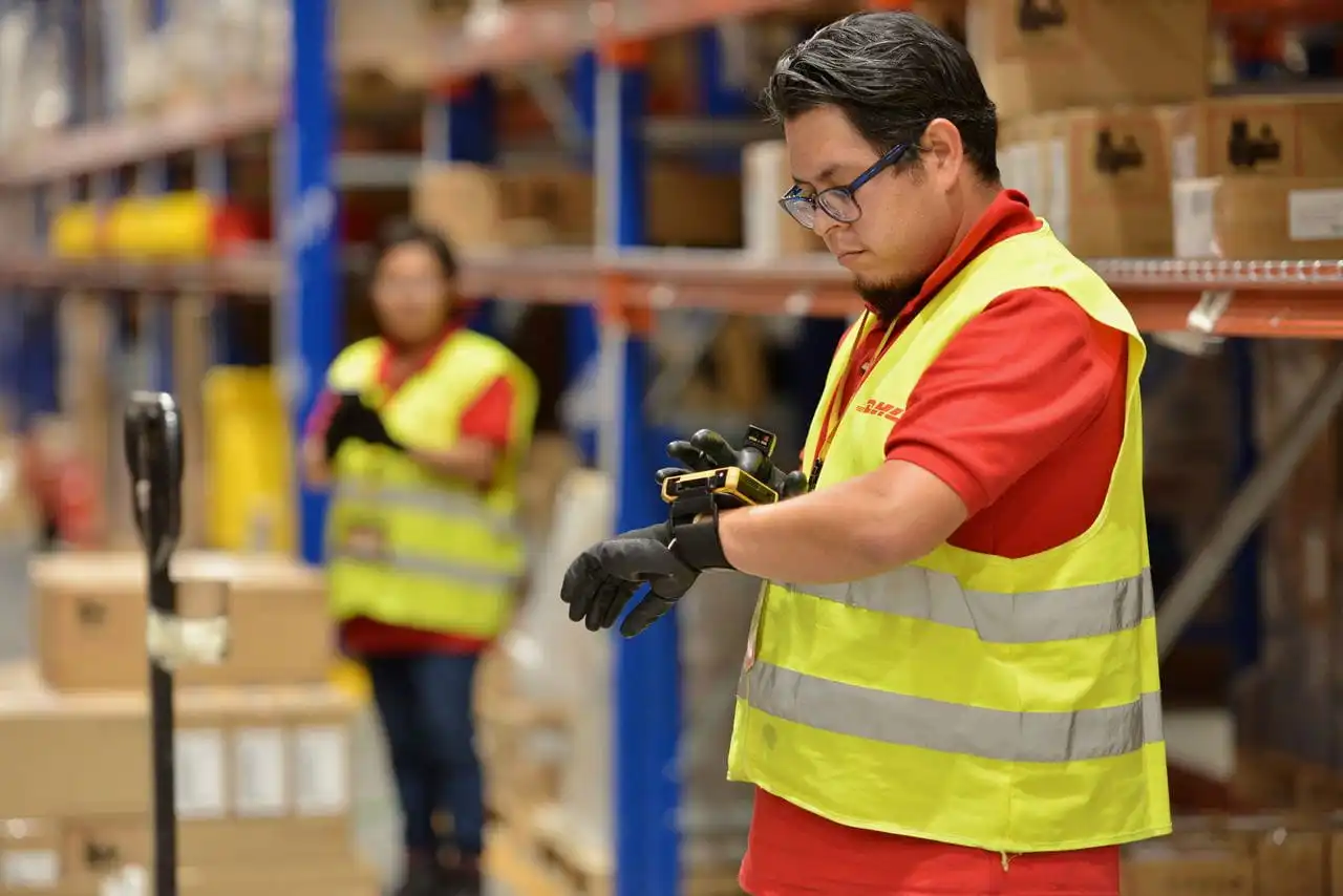  DHL workers in a warehouse
