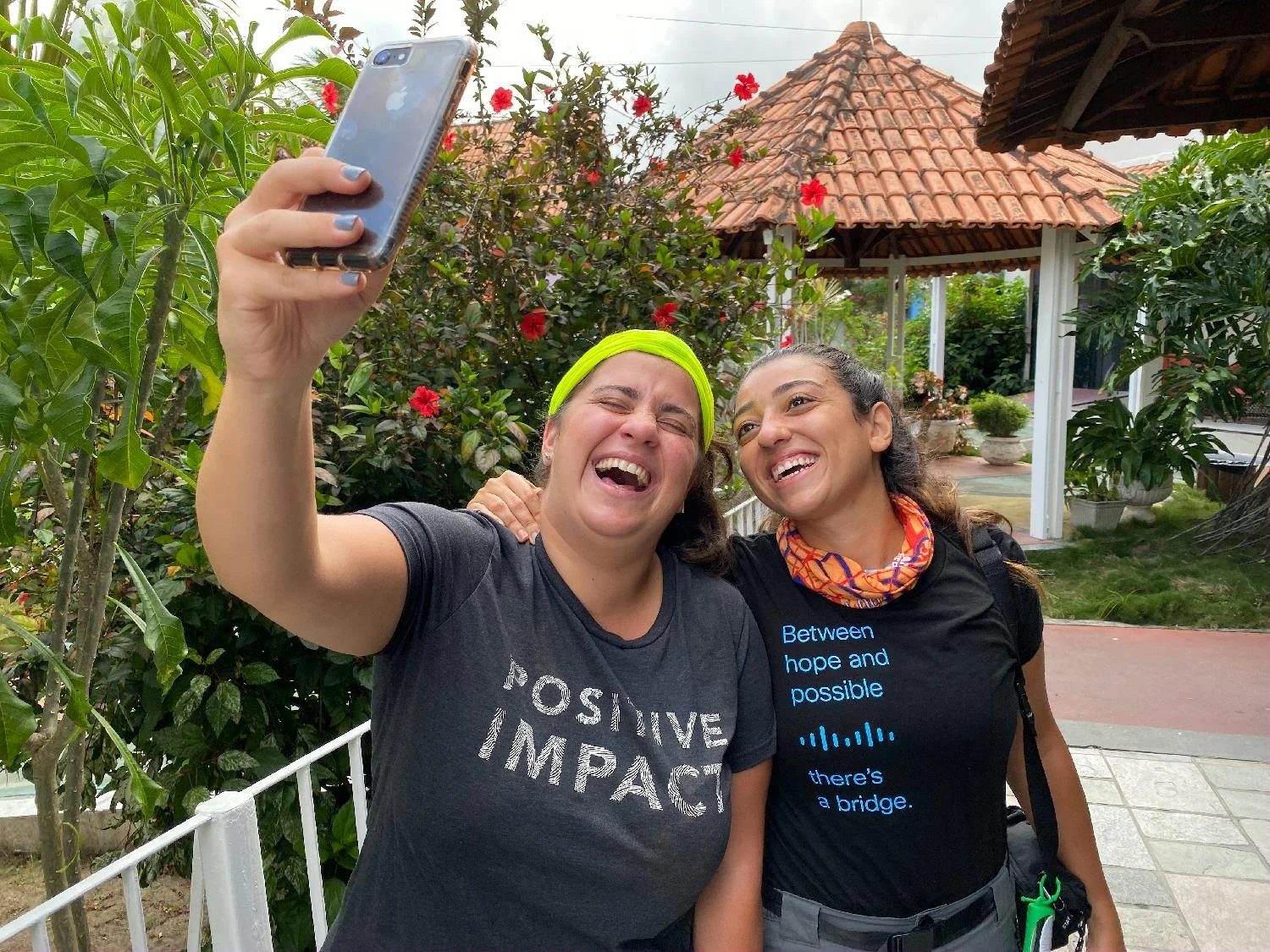 Two smiling Cisco employees take a selfie 