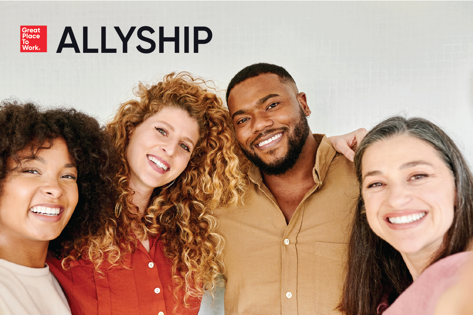  Allyship in the workplace. Four diverse employees stand together, arms linked