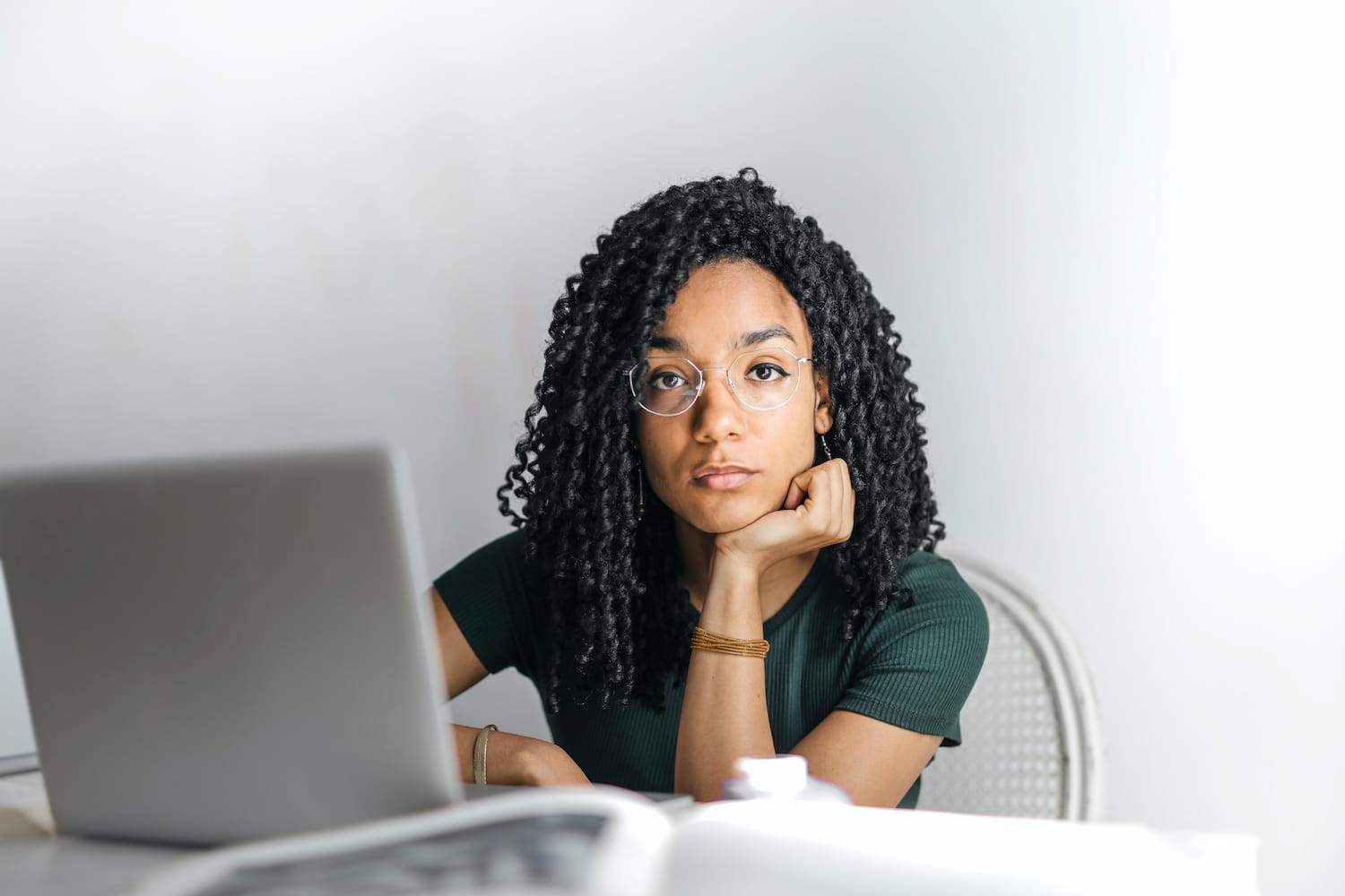 young black woman working at laptop