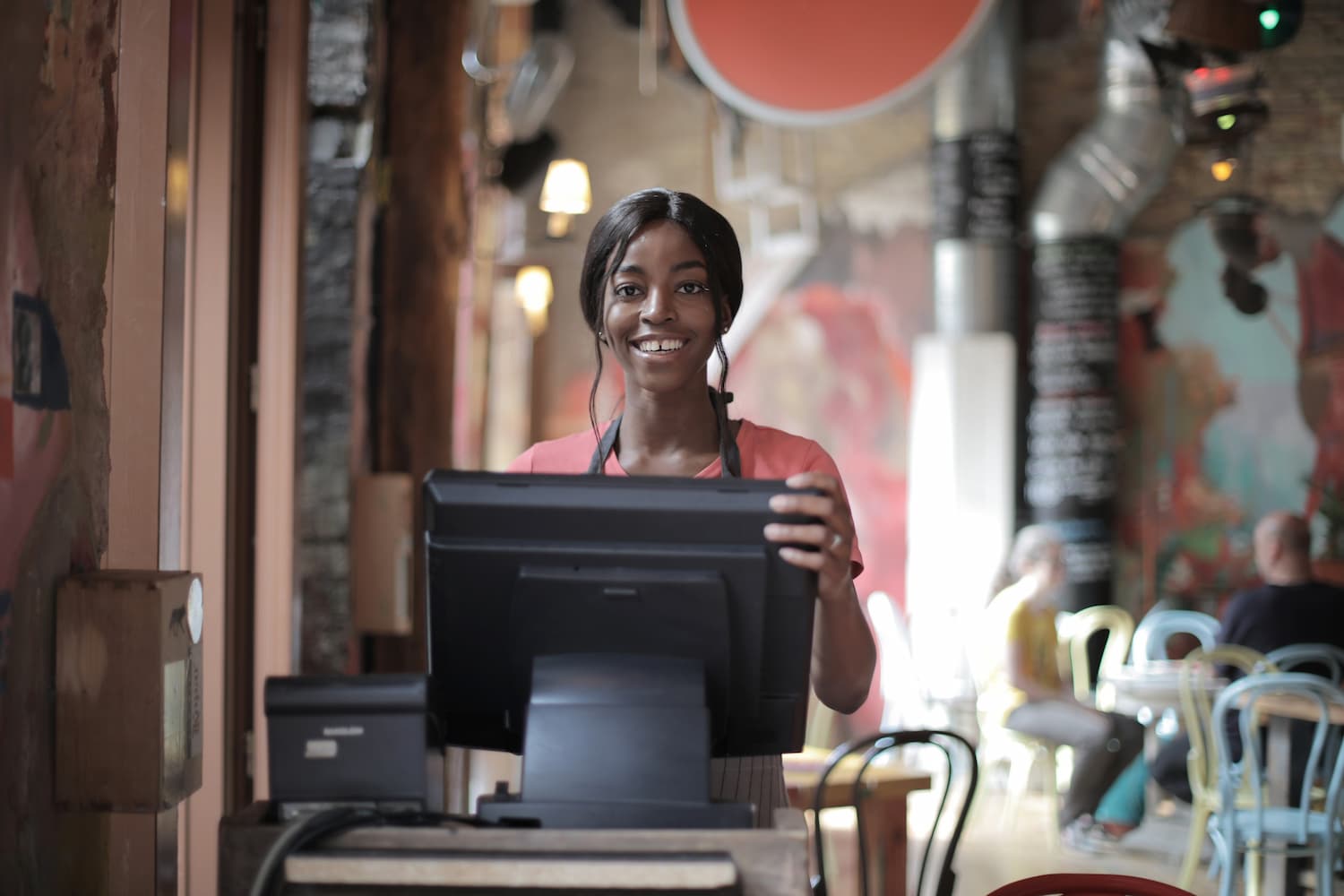  Young woman working the cash register