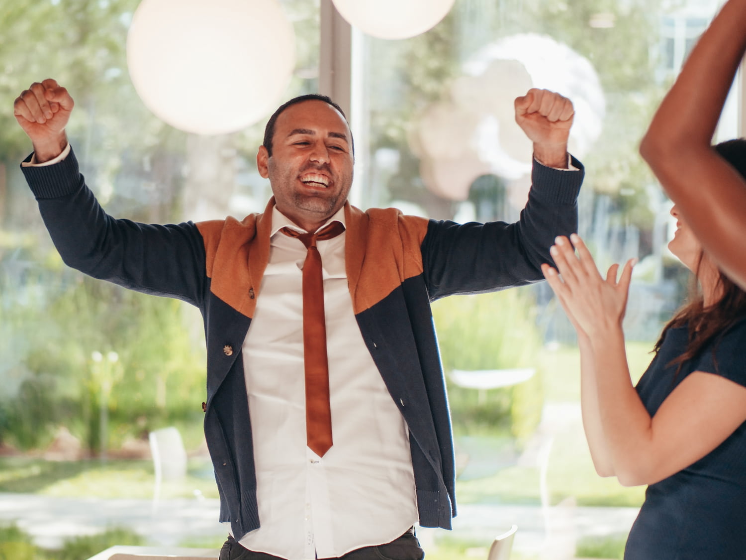  Employee recognition programs is depicted with an employee celebrating a workplace win! 