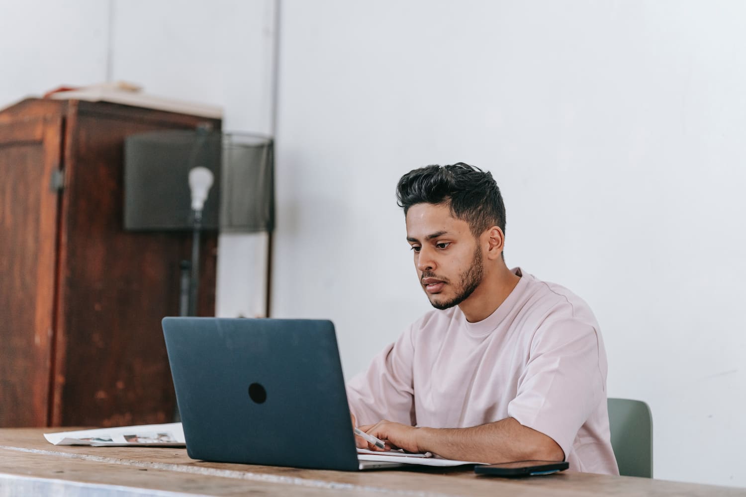  A remote worker browses his laptop