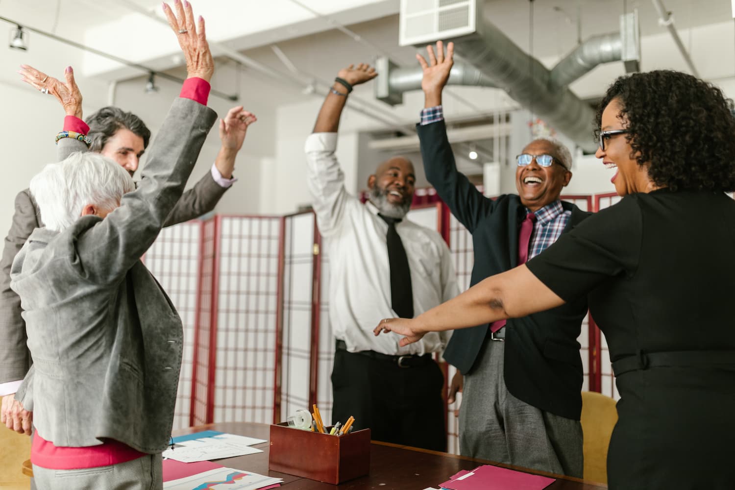  Employees throw papers into the air