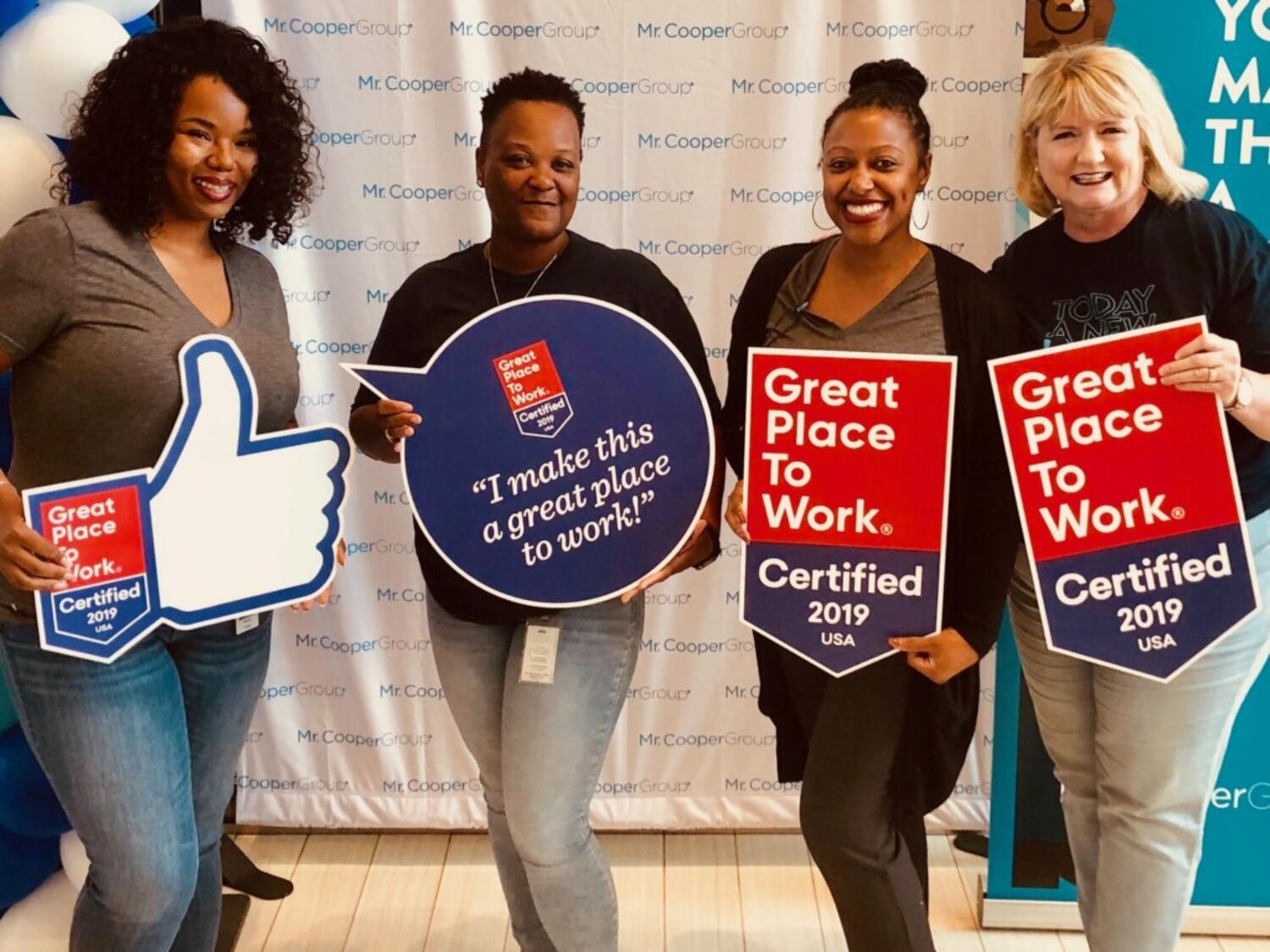  Earning a best places to work award is depicted with a group photos of employees holding Celebration props.