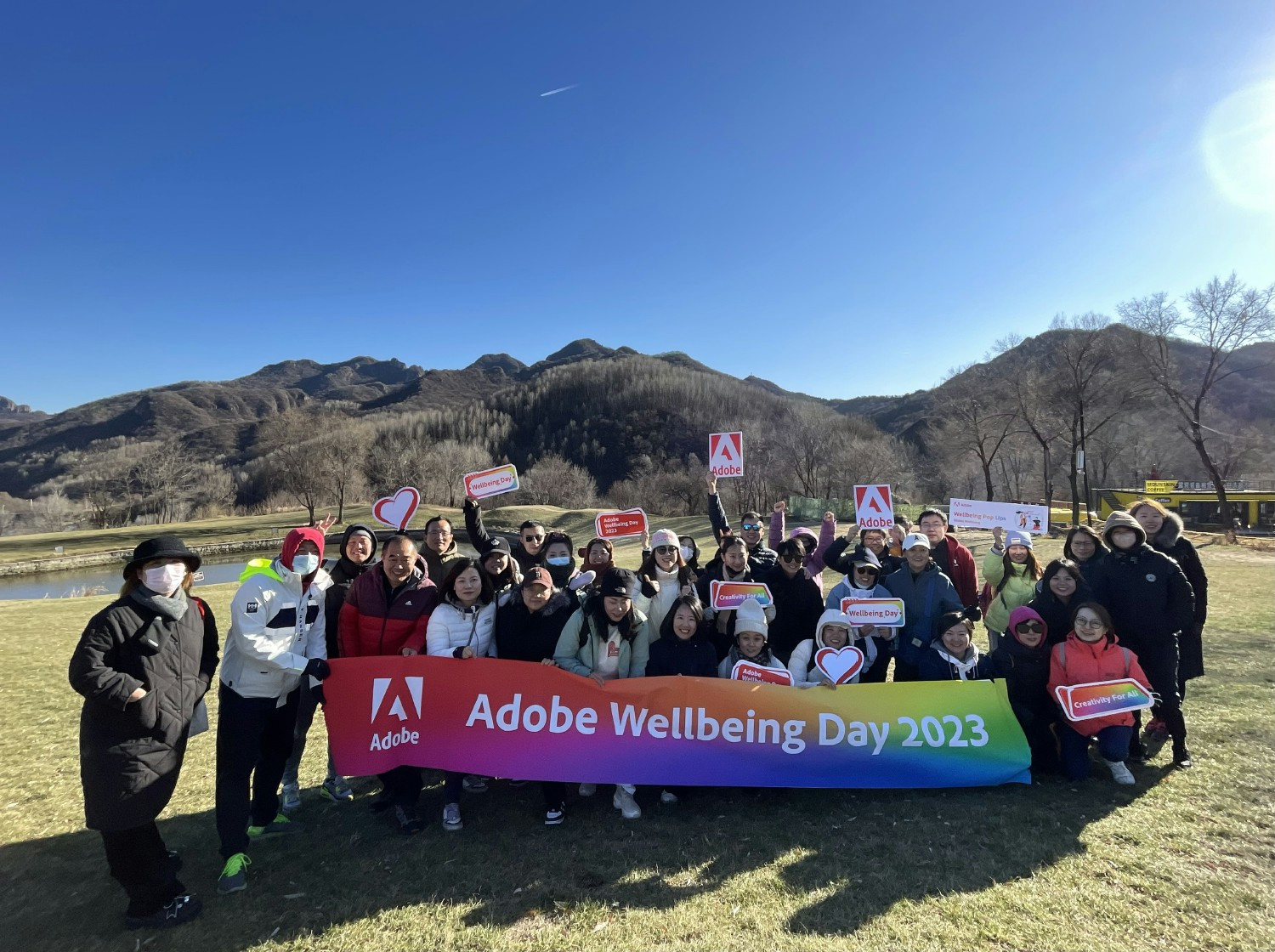 Team members coming together to prioritize health, happiness, and holistic wellness on Adobe Wellbeing Day.